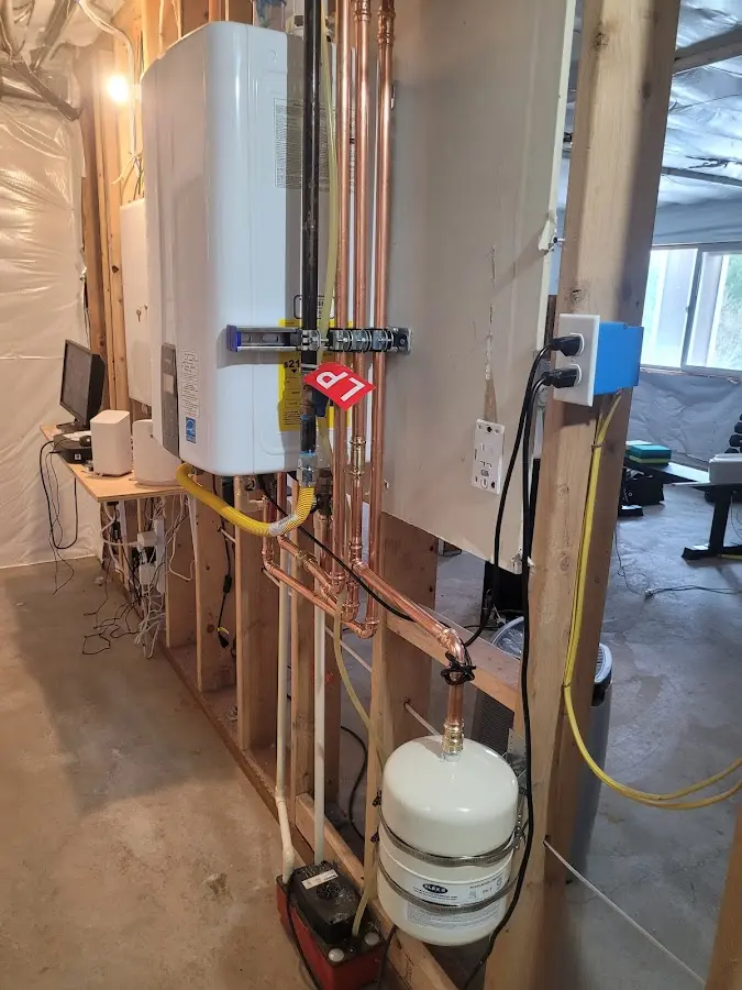 Licensed plumber repairing a kitchen sink in Cave Spring